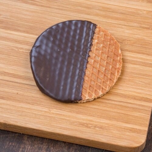Chocolate dipped Stroopie (cinnamon waffle cookie filled with caramel and dipped in chocolate)
