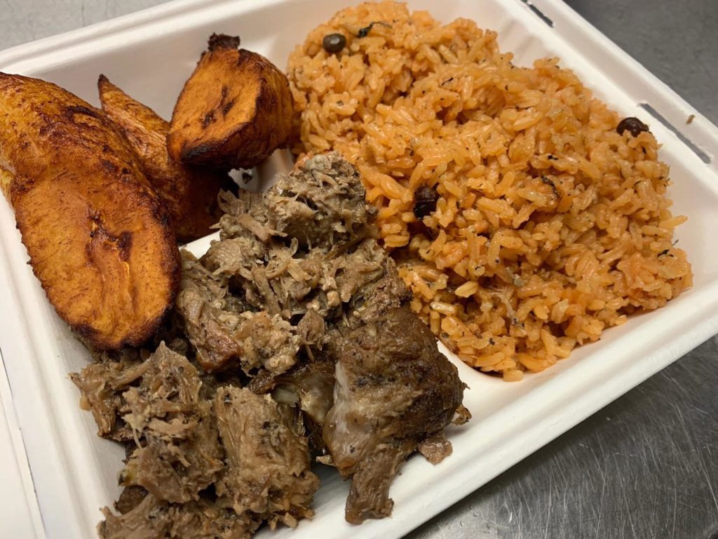 Upohar pernil with yellow rice and plantains