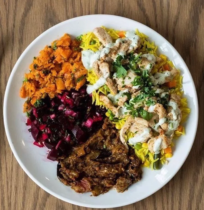 Chicken Shawarma served on Rice Pilaf with assorted Moroccan Salads