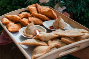 Assorted empanadas and samosa during cocktail hour. Photo by Renee Mira